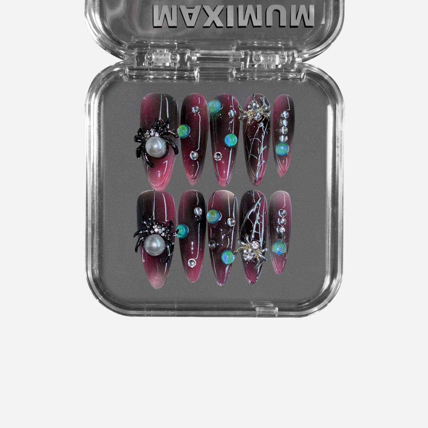 Midnight Venom" – a black & red gradient stiletto press-on nail set featuring gothic spider embellishments, web detailing, iridescent gemstone accents, and pearl inlays for a hauntingly luxurious look.