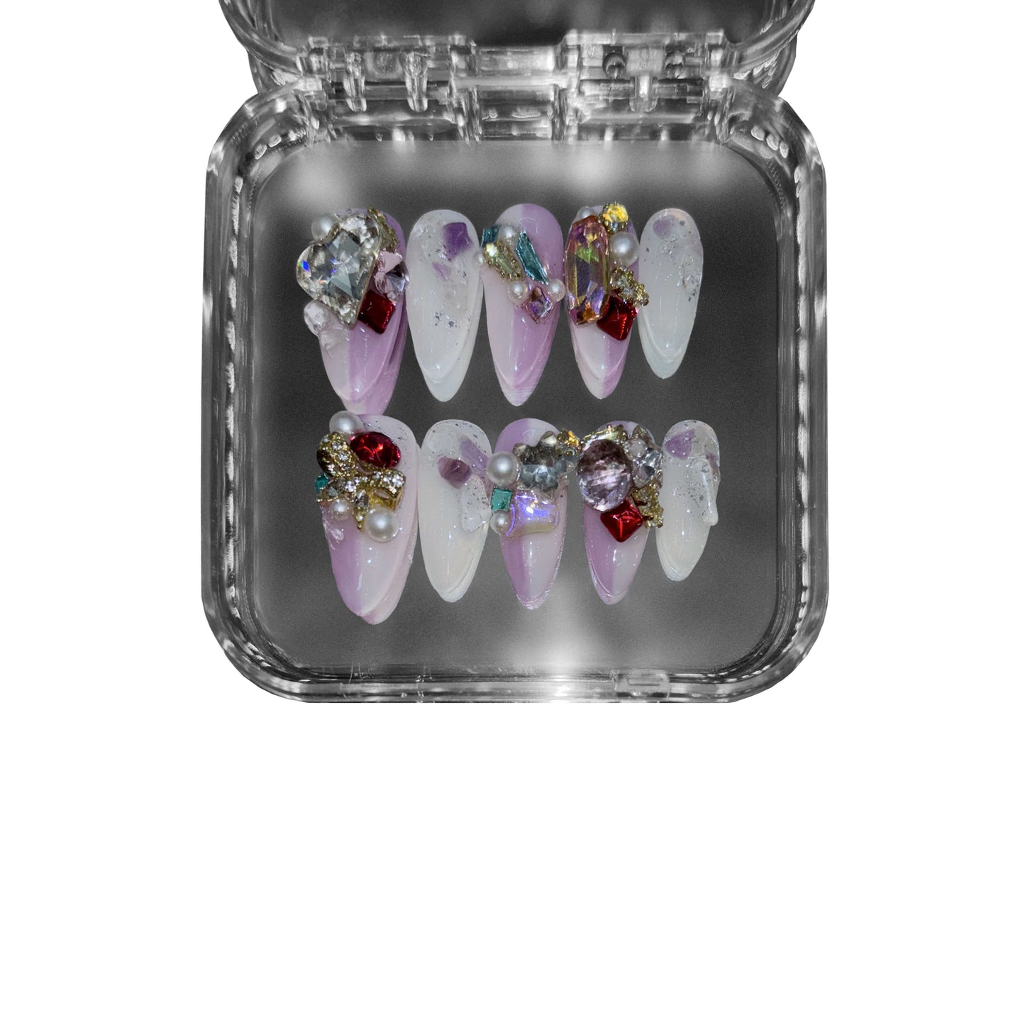 "Amethyst Reverie" – a purple almond-shaped press-on nail set featuring a gradient amethyst base, dazzling gemstones, 3D embellishments, and celestial accents.