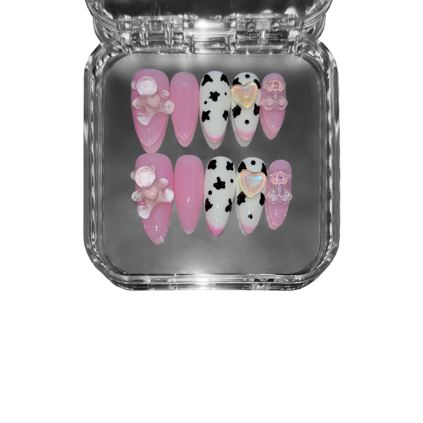"Berry Moo" – a pink almond-shaped press-on nail set featuring cow print details, glossy finish, and adorable 3D teddy bear embellishments for a playful and chic aesthetic.