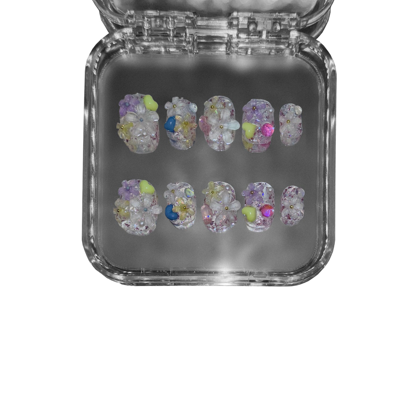 "Dewborn Petals" – a clear short round press-on nail set featuring 3D floral embellishments, a soft dewdrop-like effect, and an ethereal translucent base.