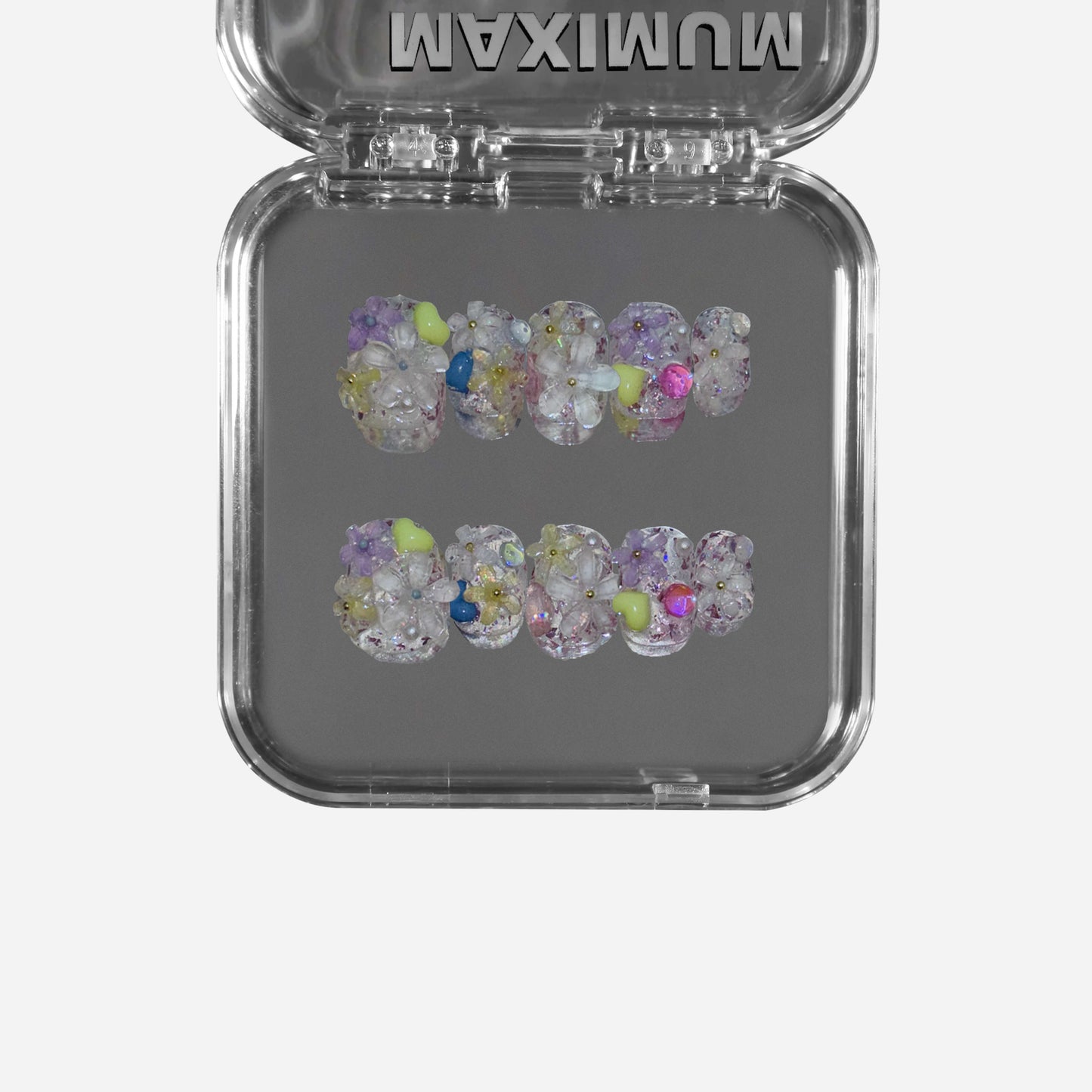 "Dewborn Petals" – a clear short round press-on nail set featuring 3D floral embellishments, a soft dewdrop-like effect, and an ethereal translucent base.