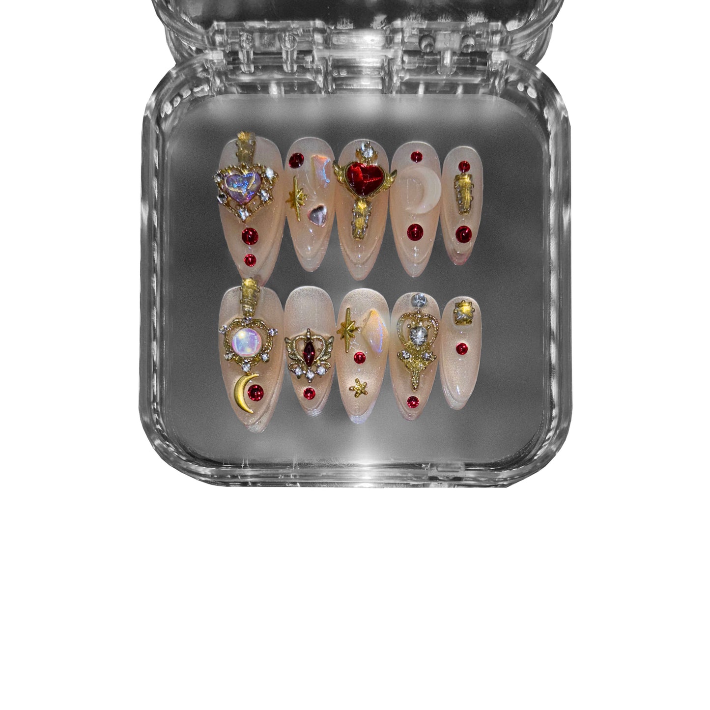 "Stellar Priestess" – a celestial almond-shaped press-on nail set featuring golden embellishments, radiant red gemstones, and cosmic-inspired details for an opulent and mystical aesthetic.