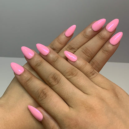 Both hands wearing Pearl Glaze Cotton Candy press-on nails, glossy pearl surface and elegant almond shape.