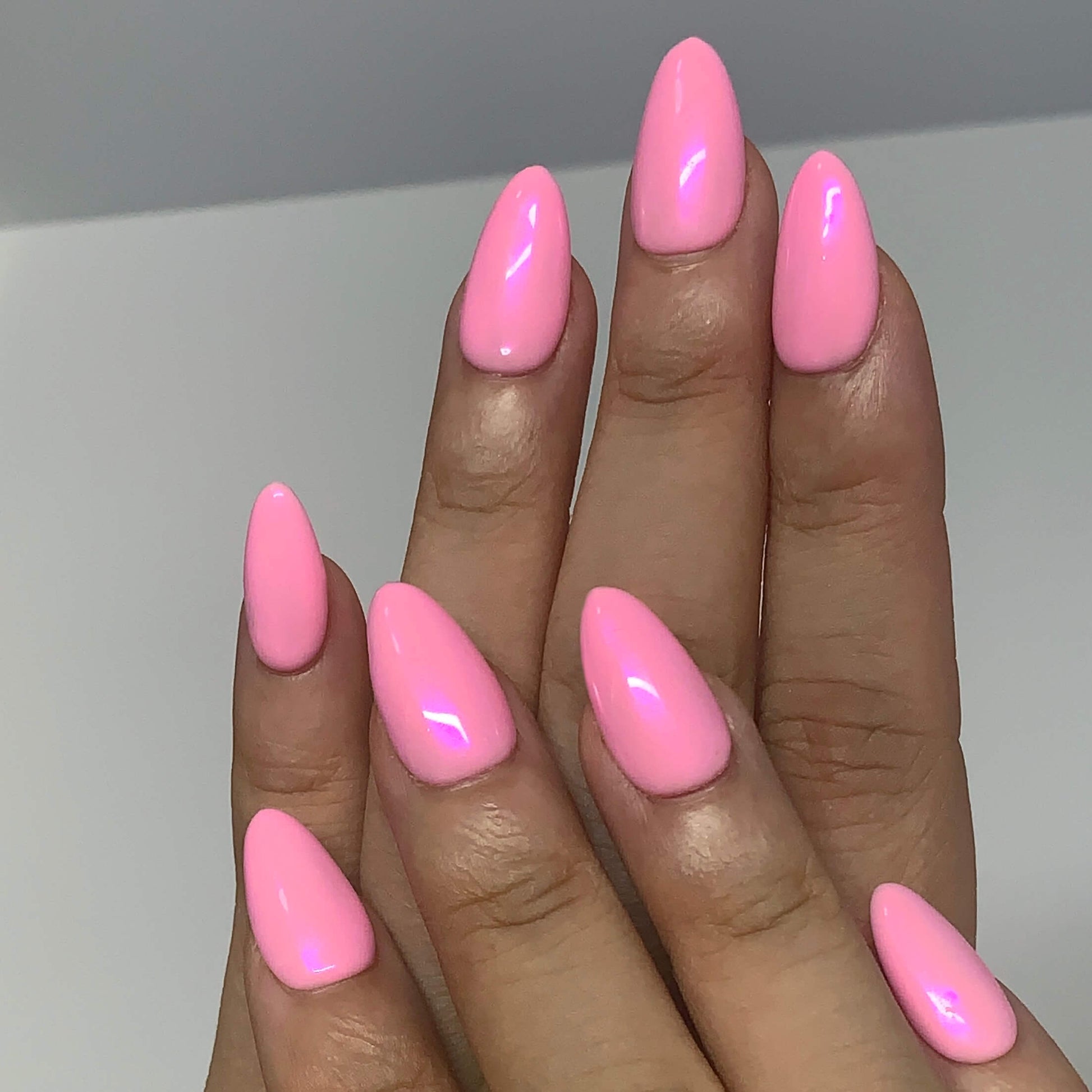Front view of both hands with Pearl Glaze Cotton Candy press-on nails, smooth pink pearl tone and clean manicure style.