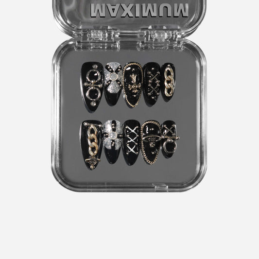 Chain Cathedral almond press-on nails with gothic chains, crosses, rings, and Saturn-inspired details.