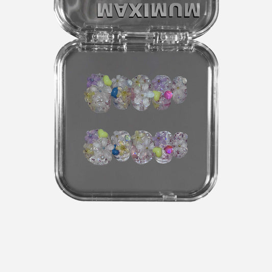 "Dewborn Petals" – a clear short round press-on nail set featuring 3D floral embellishments, a soft dewdrop-like effect, and an ethereal translucent base.