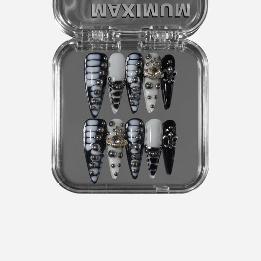 Eclipsera round press-on nails with black and gray-white glossy contrast finish.