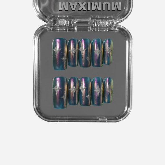 Square press-on nails with iridescent violet-blue chrome base, silver Pop Art stars, and holographic shine for a Y2K futuristic look.