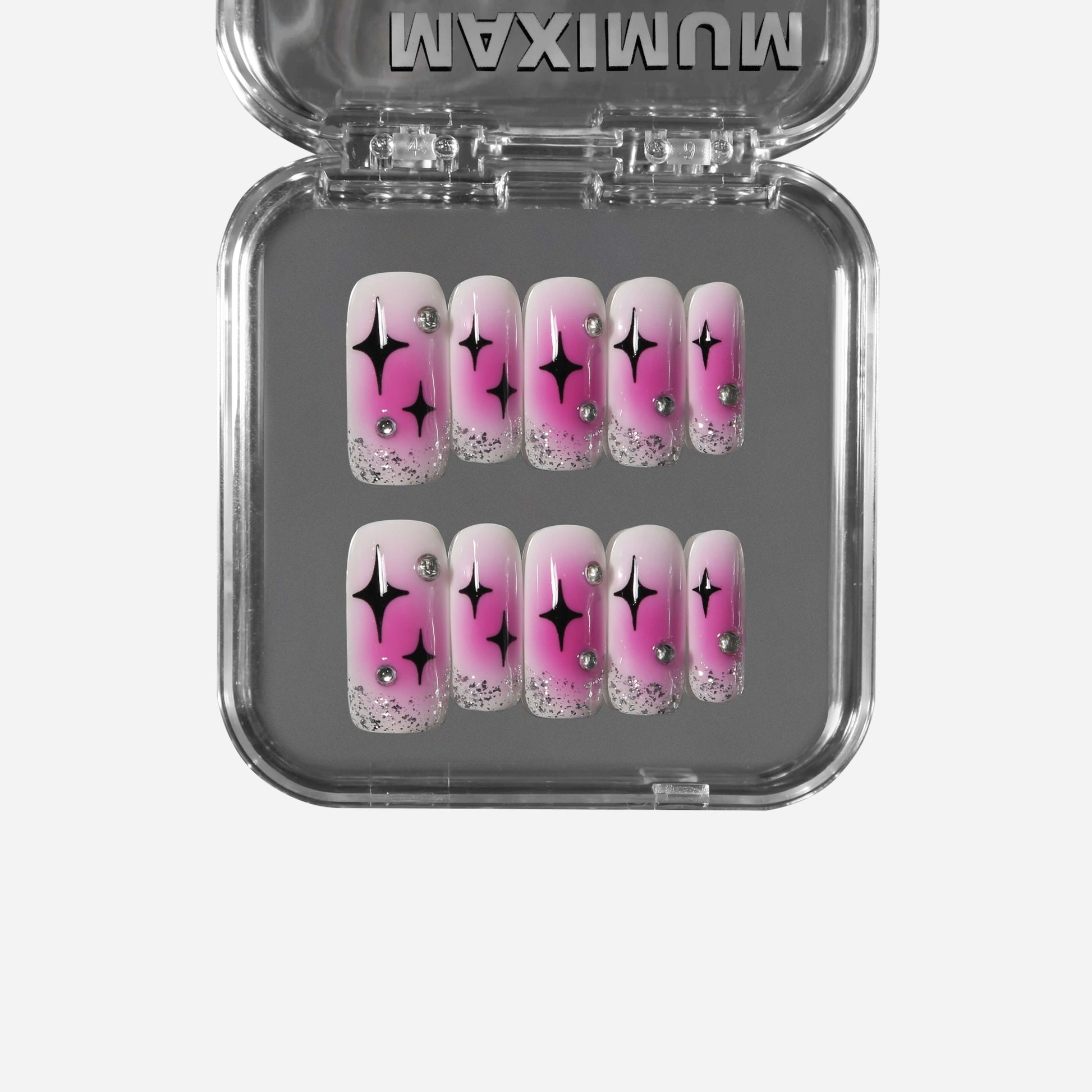 Square press-on nails with hot pink blush gradient, black Pop Art stars, silver glitter, and rhinestone accents for a bold Y2K retro style.