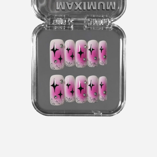 Square press-on nails with hot pink blush gradient, black Pop Art stars, silver glitter, and rhinestone accents for a bold Y2K retro style.