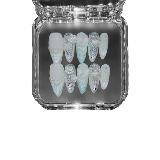  "Frosted Lattice" – a blue almond-shaped press-on nail set featuring lace-inspired designs, delicate pearls, 3D floral accents, and shimmering glitter for an elegant aesthetic.