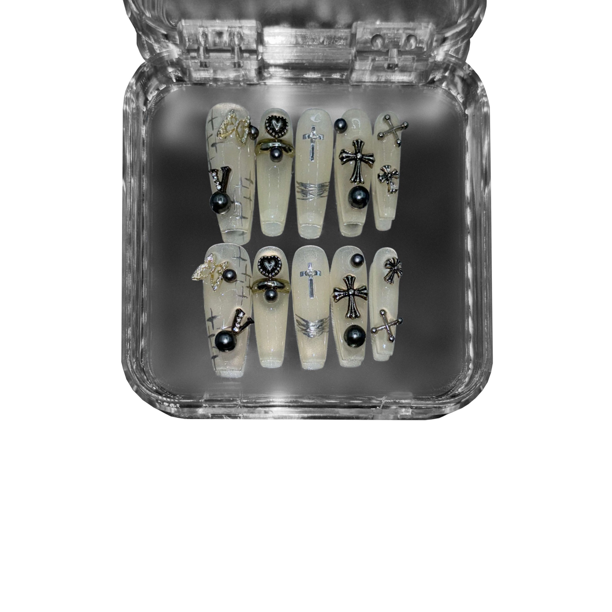  "Holy Requiem" – a translucent beige coffin-shaped press-on nail set featuring gothic cross embellishments, black pearls, metallic accents, and sheer milky layers for an ethereal, high-fashion manicure.