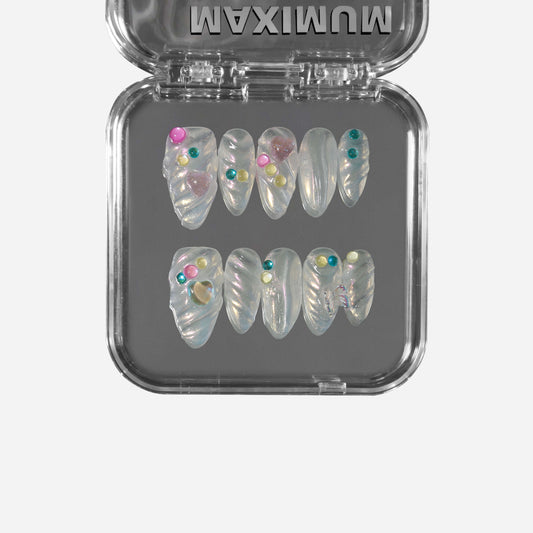 Handmade almond press-on nails with semi-transparent jelly base, iridescent pearl powder, seashell ripples, and colorful candy beads.