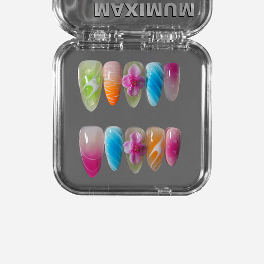 Almond press-on nails with tropical gradients, 3D orchid flowers, bubble details, and playful summer colors for a Paradise Punch aesthetic.