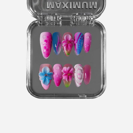 Handmade almond press-on nails with psychedelic pink and blue swirls, 3D floral accents, polka dots, and glossy waterdrop textures.