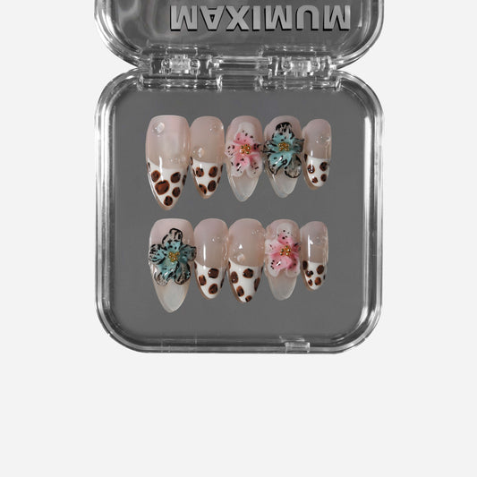 Savanna Blossom almond press-on nails with leopard French tips and 3D floral designs.