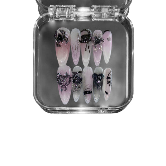 "Soirée of the Widow" – a black stiletto-shaped press-on nail set featuring gothic lace patterns, metallic spiders, and a seductive dark-to-light gradient for a luxurious gothic aesthetic.