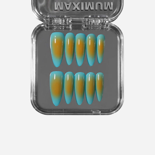 Stiletto press-on nails with a seamless blue-to-amber tropical gradient; lightweight, reusable, and perfect for summer vacation looks.